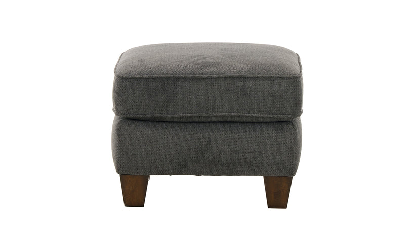 Gray upholstered ottoman on a white background